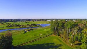 Golf course next to a pond