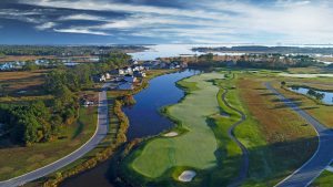 Aerial view of golf course next to bay