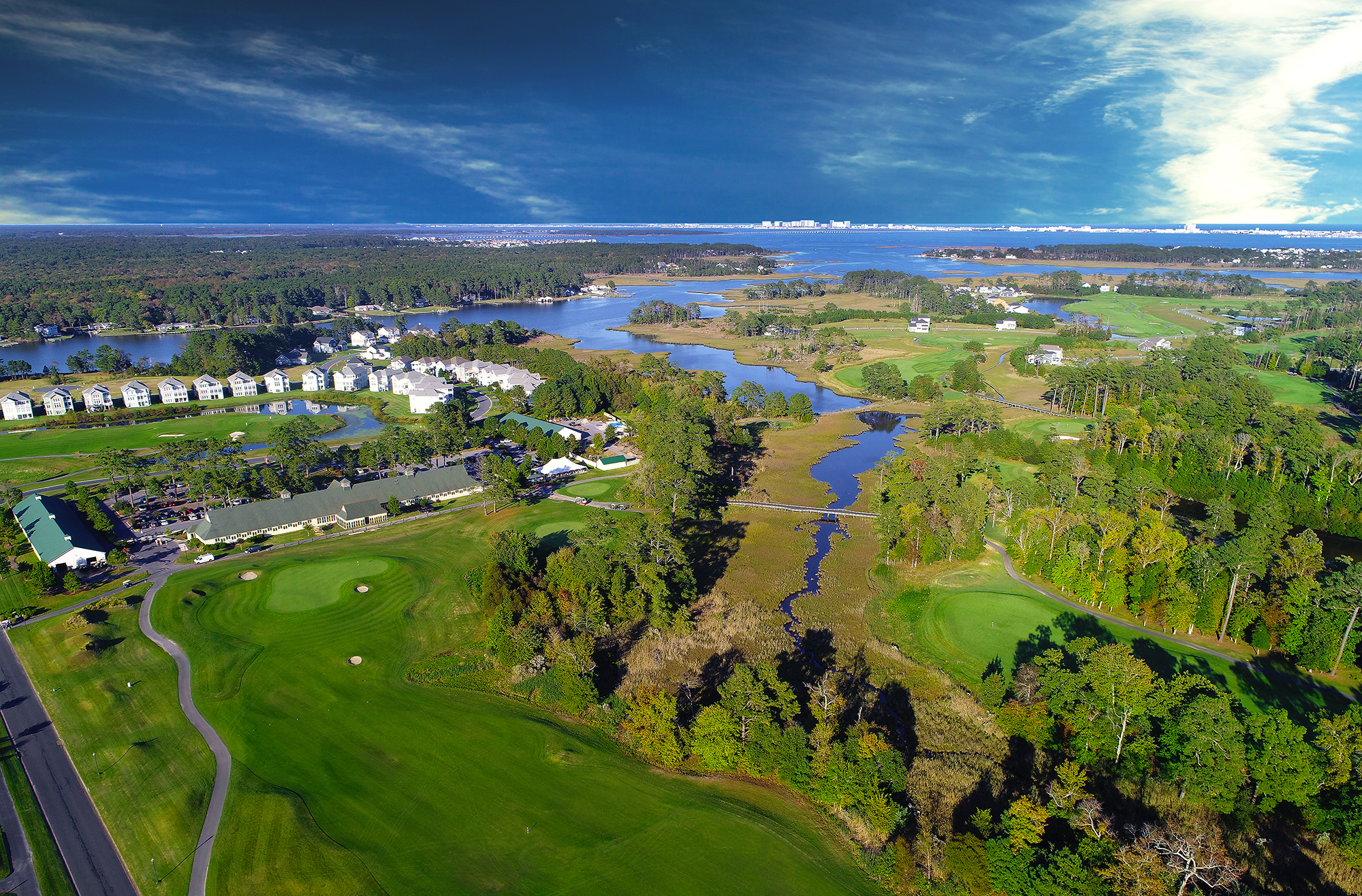 Aerial view of golf course, the bay and the ocean